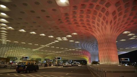 Mumbai Airport - drop off zone with red lit tree inspired design