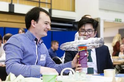 Two graduates making a space model