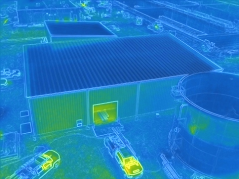 Thermographic drone image of the outside of a building from above