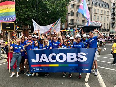Jacobs employees holding pride banner on parade in London