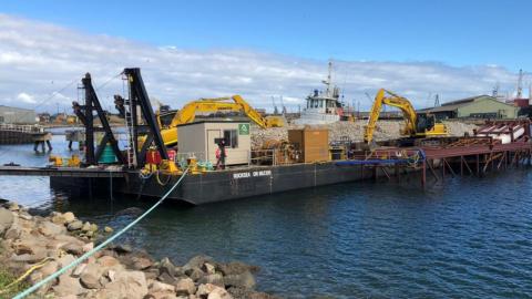 Construction equipment on floating barge at Windara Reef