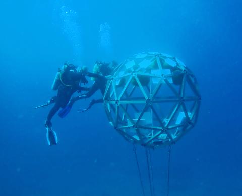 Jacobs divers install a geodesic sphere offshore 