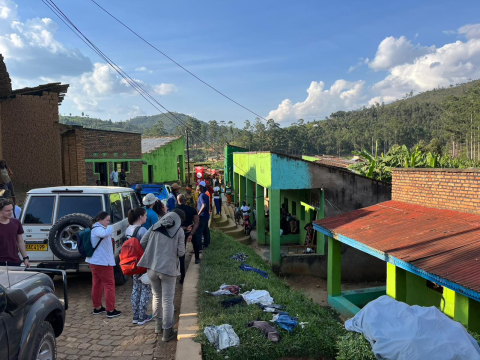 B2P team walks in a city market in Rwanda