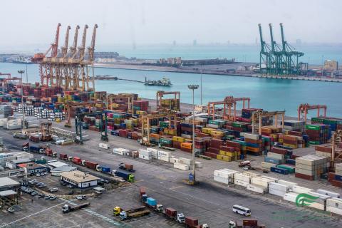 Aerial view of a container port with cranes