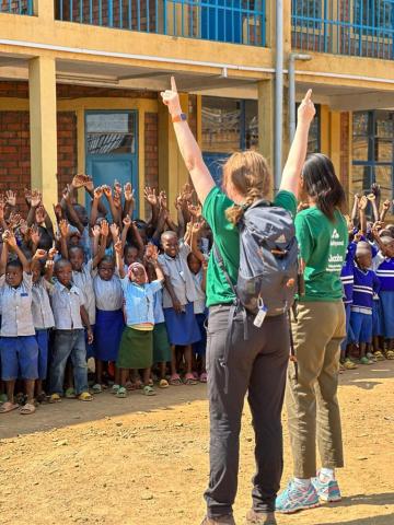 Cheering with local school children