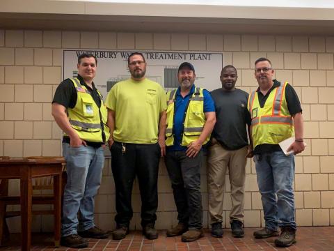 Team of engineers in their yellow PPE