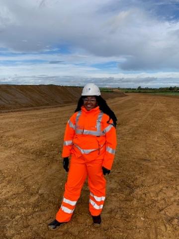 Alexandra Ismay on a project site in orange PPE