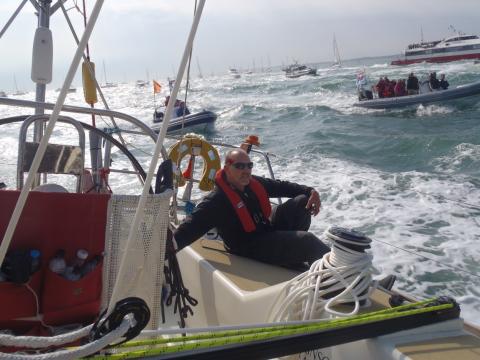 Tom Foster steering the best line at the Clipper Race start August 2011