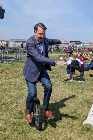 Graeme Cooper riding a unicycle