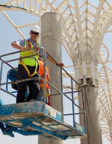 Tom Foster poses with the Madinah Terminal Roof Trees