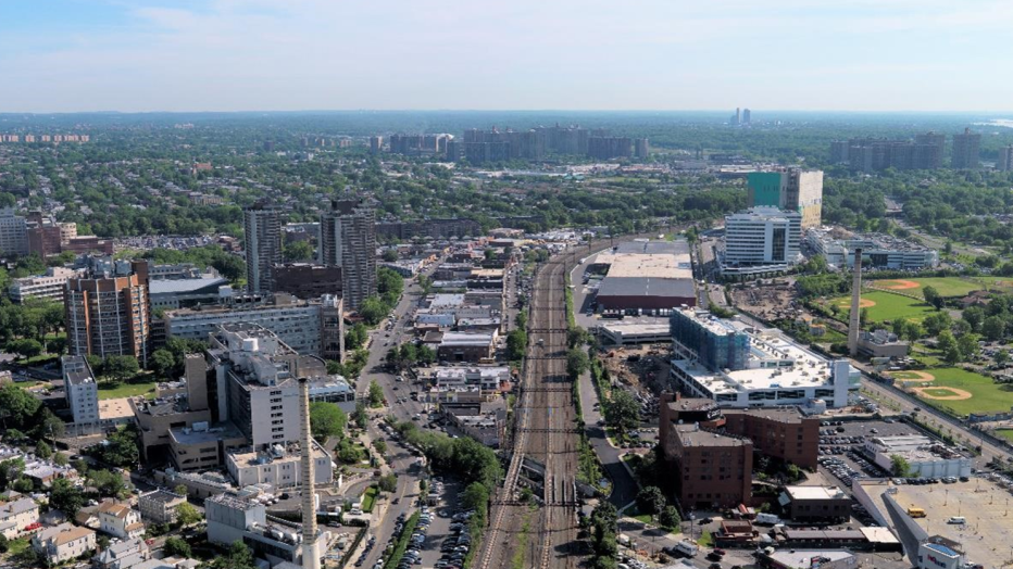 Train tracks through a cityscape