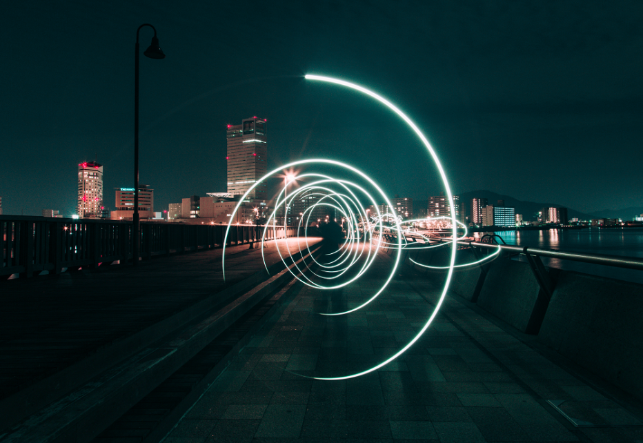 Stock image an electric swirl on a bridge with a cityscape in the background