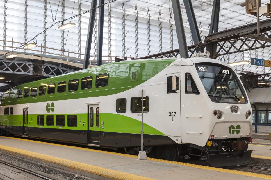 Green and white Hydrail train parked