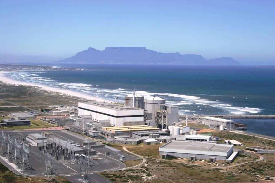 Aerial view of a power plant on the coast of a body of water