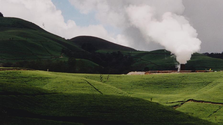 Geothermal plant in rolling green hills