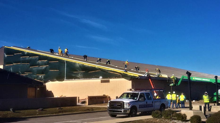 Truck sits outside of Tyndall Air Force base where construction is taking place on the roof of a facility