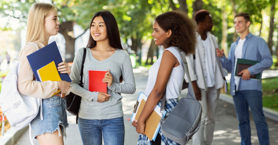 women students talking on campus