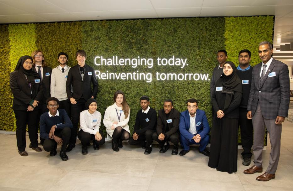 Students pose at the London Cottons Centre Office with Bob Pragada and Brian Cox