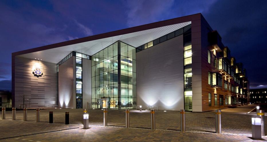 Clough Road Police Station at night.