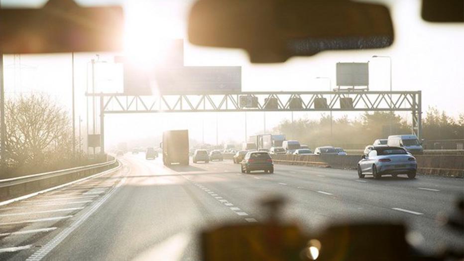 View from inside of a vehicle onto a multi-lane highway