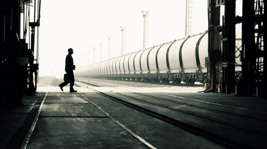 Etihad Rail - worker walking towards long train