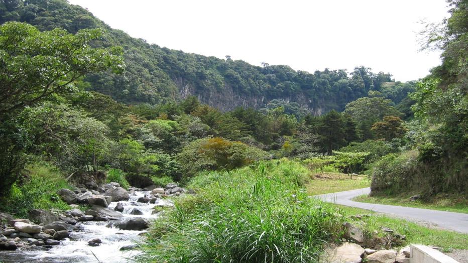 River running through green hills