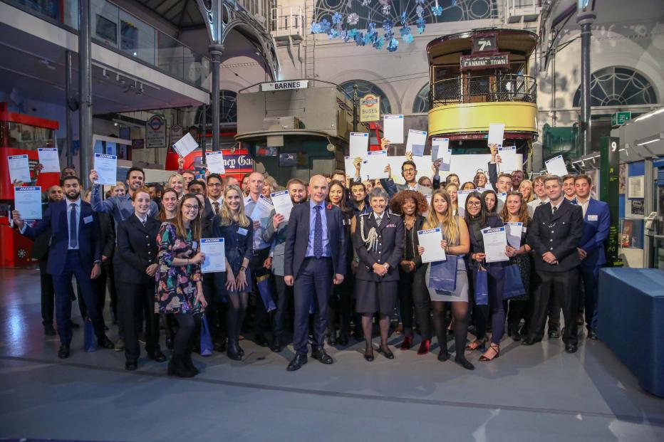 Group of staff posed outside the London Transport Museum 