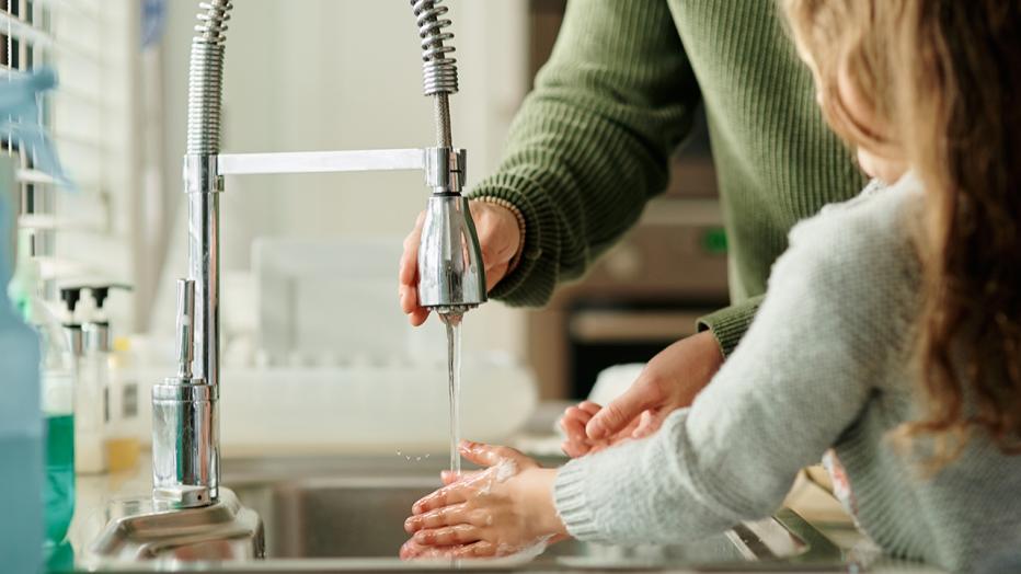 Girl washing hands 