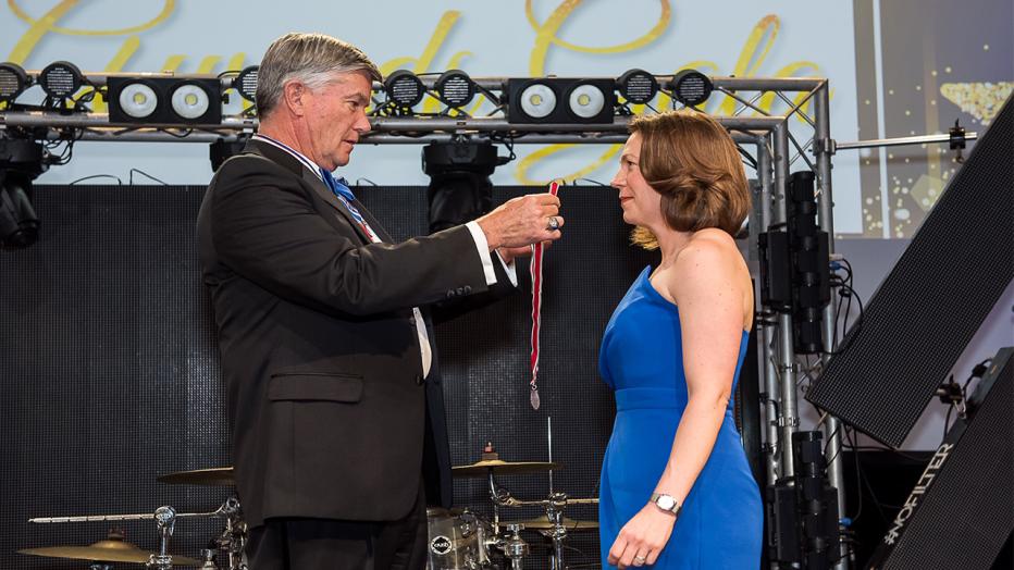 Caroline Roberts receiving her medal