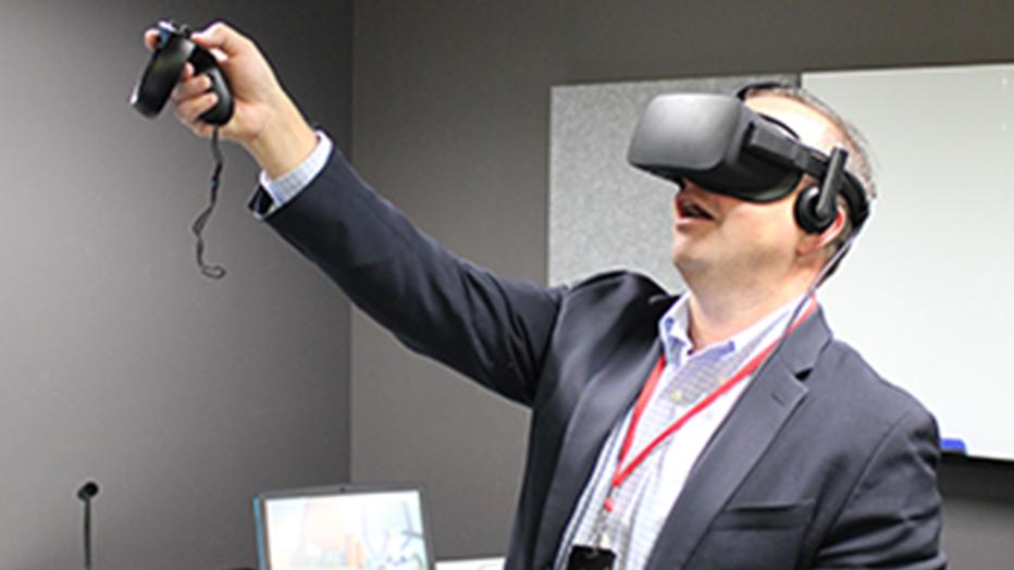 Man in a suit using VR