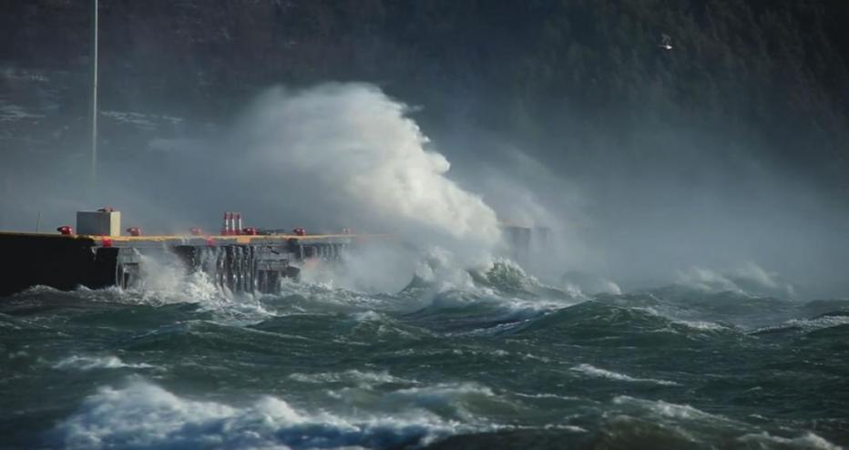 Stock image of water washing up on infrastructure