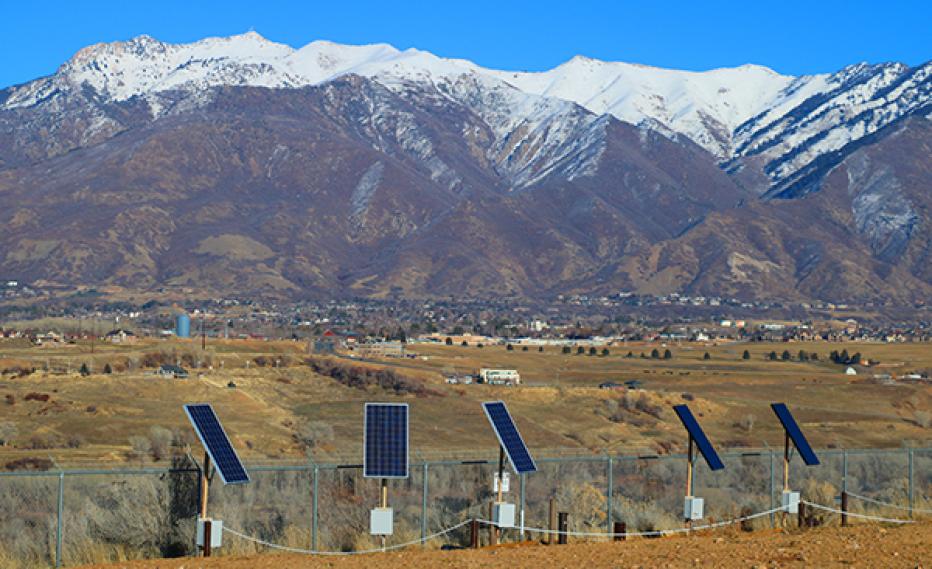 Solar panels in front of mountains