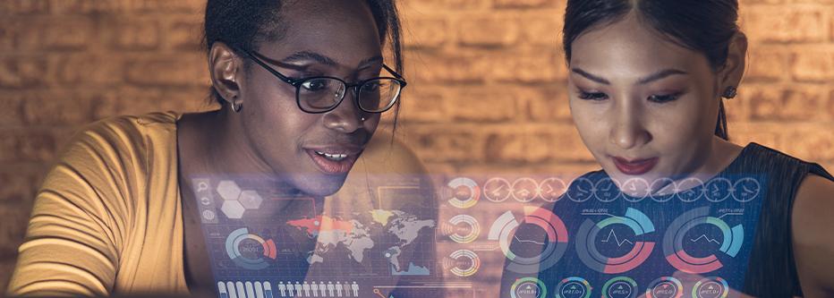 Black woman and mideast woman looking at a hologram of location based data