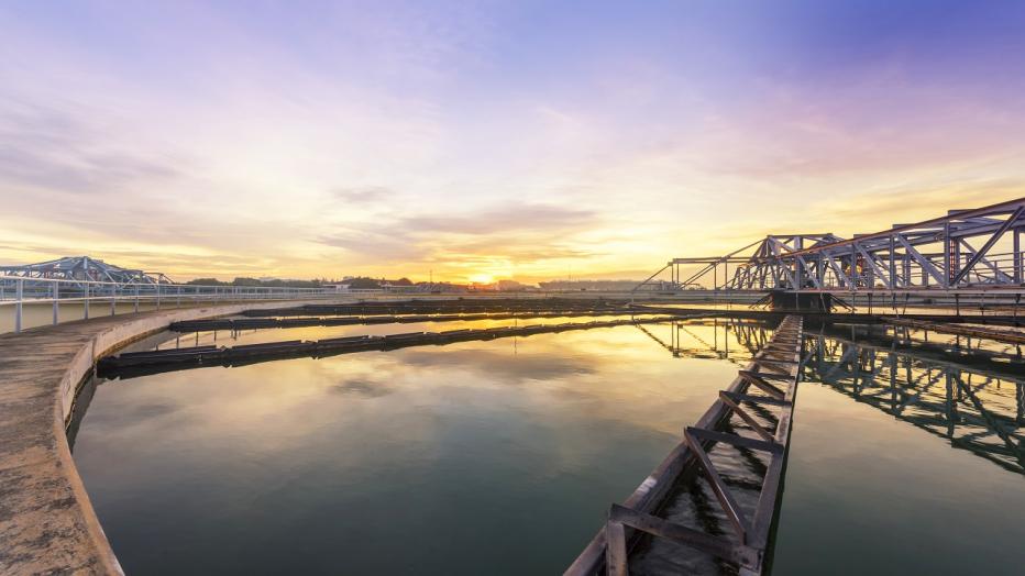 Wastewater treatment facilities at sunset