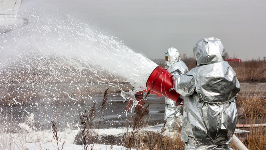 Spraying aqueous film-forming foam (containing PFAS) in training at an airport