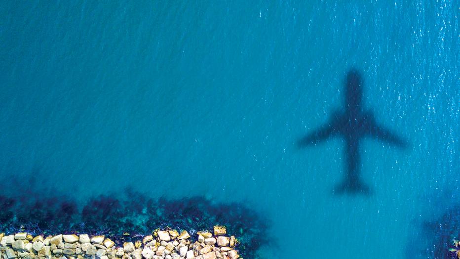 Shadow of a plane on the sea