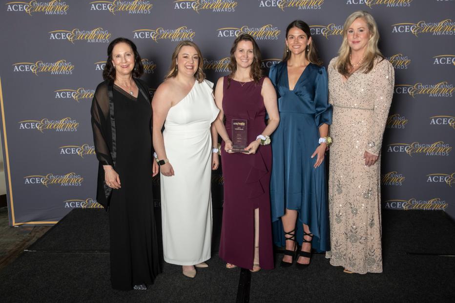 Five women in formal dress with their award at ACEC