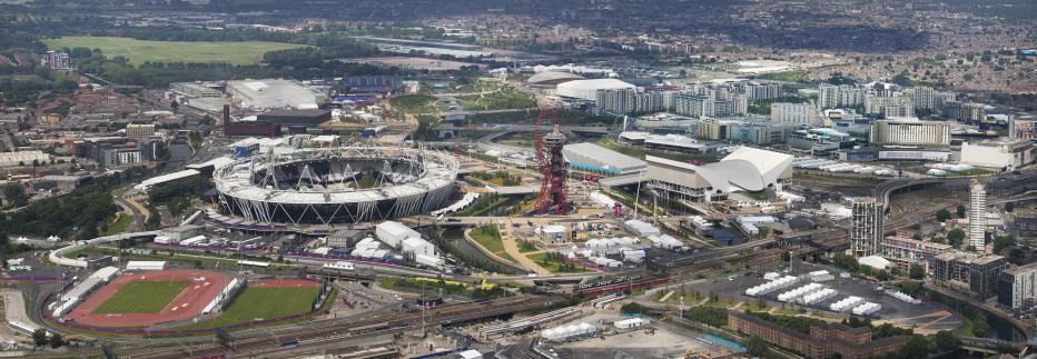 Aerial view of Queen Elizabeth Olympic Park in London, with views of stadium and other amenities.