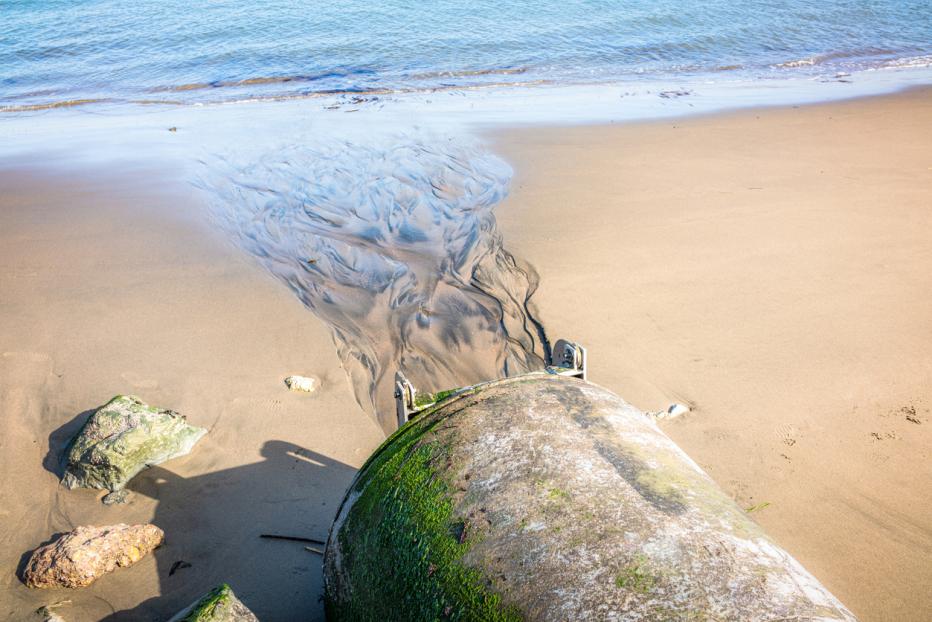 Water spilling onto beach