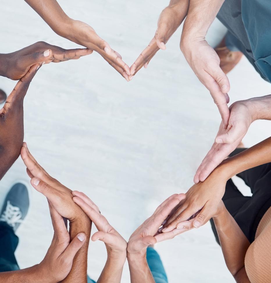 Diverse hands making a heart symbol