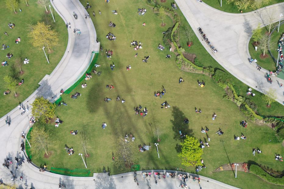 Aerial view of people in a green space with paved pathways