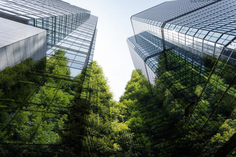 Looking up at a building with trees in the background