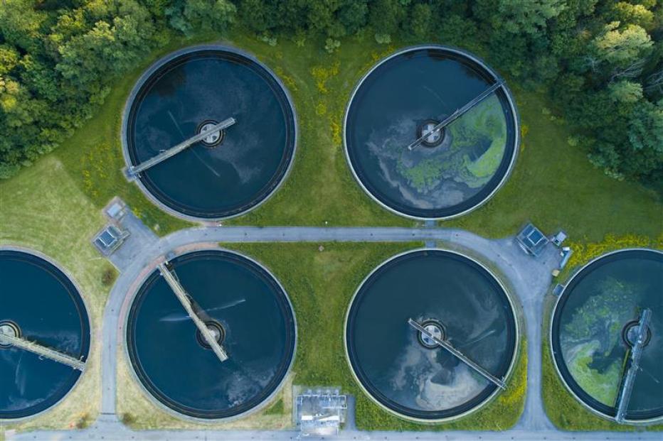 Aerial view of a city's waste management sewage and water treatment plants. Waste water purification.