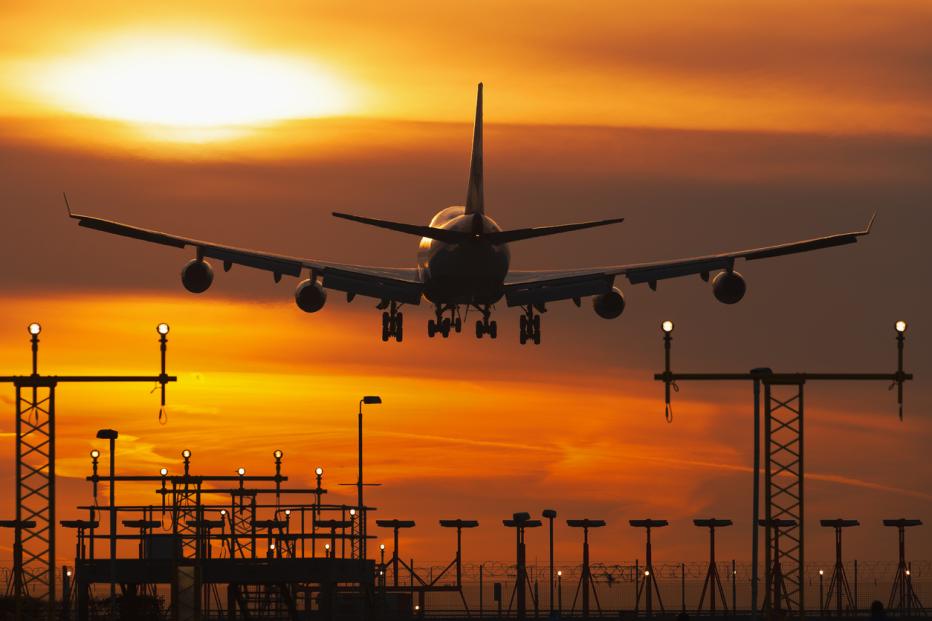 Plane in the sunset sky