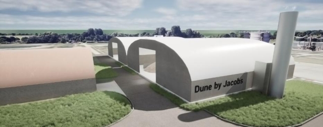 Computer‑generated rendering of a modern industrial facility with curved roof structures, landscaped paths, and the text “Dune by Jacobs” displayed on one building.