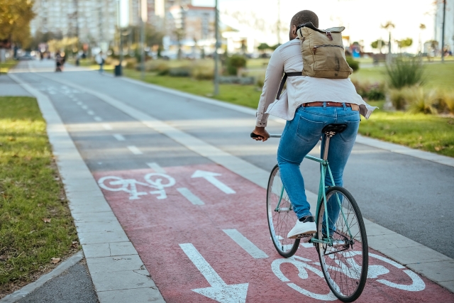 someone cycling down a road