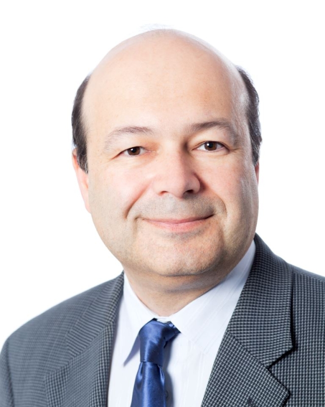head and shoulders image of man in grey suit