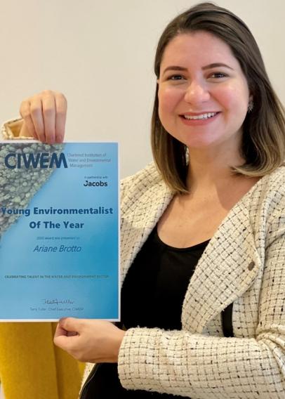 Ariane Brotto holding her award for Young Environmentalist of the Year