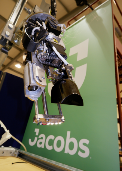 Jacobs robot in front of green Jacobs banner