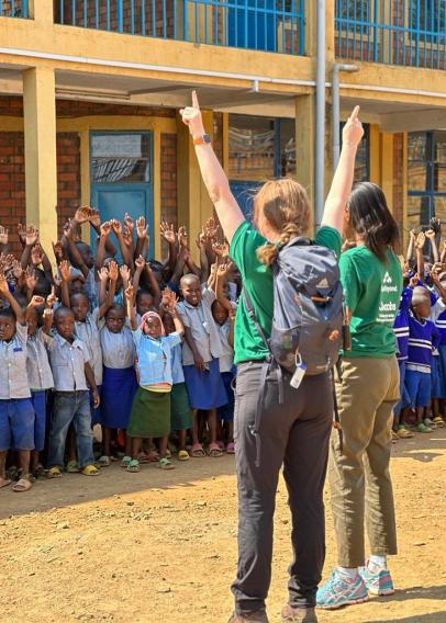 Cheering with local school children